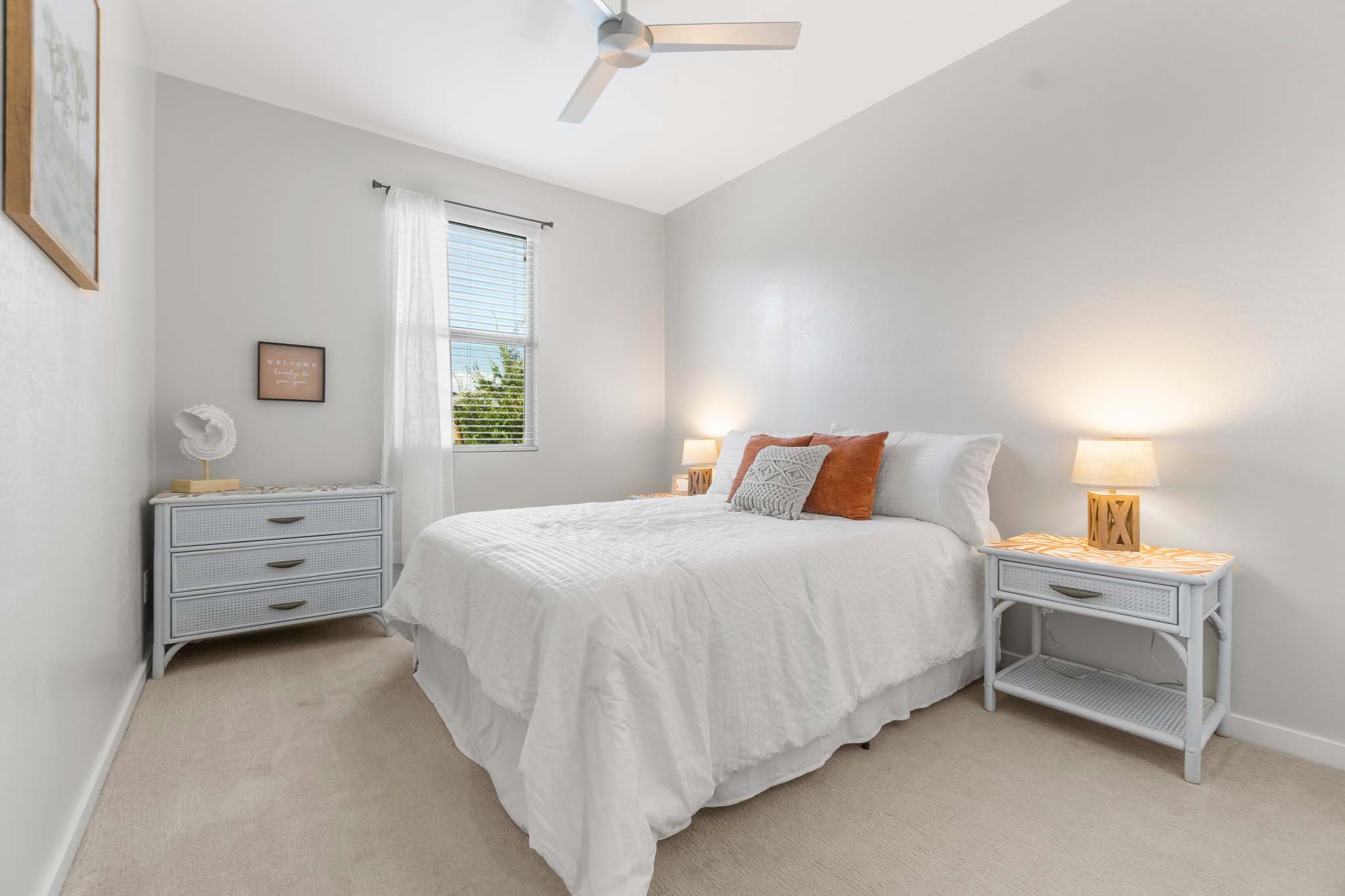 a bedroom with a bed and lamps